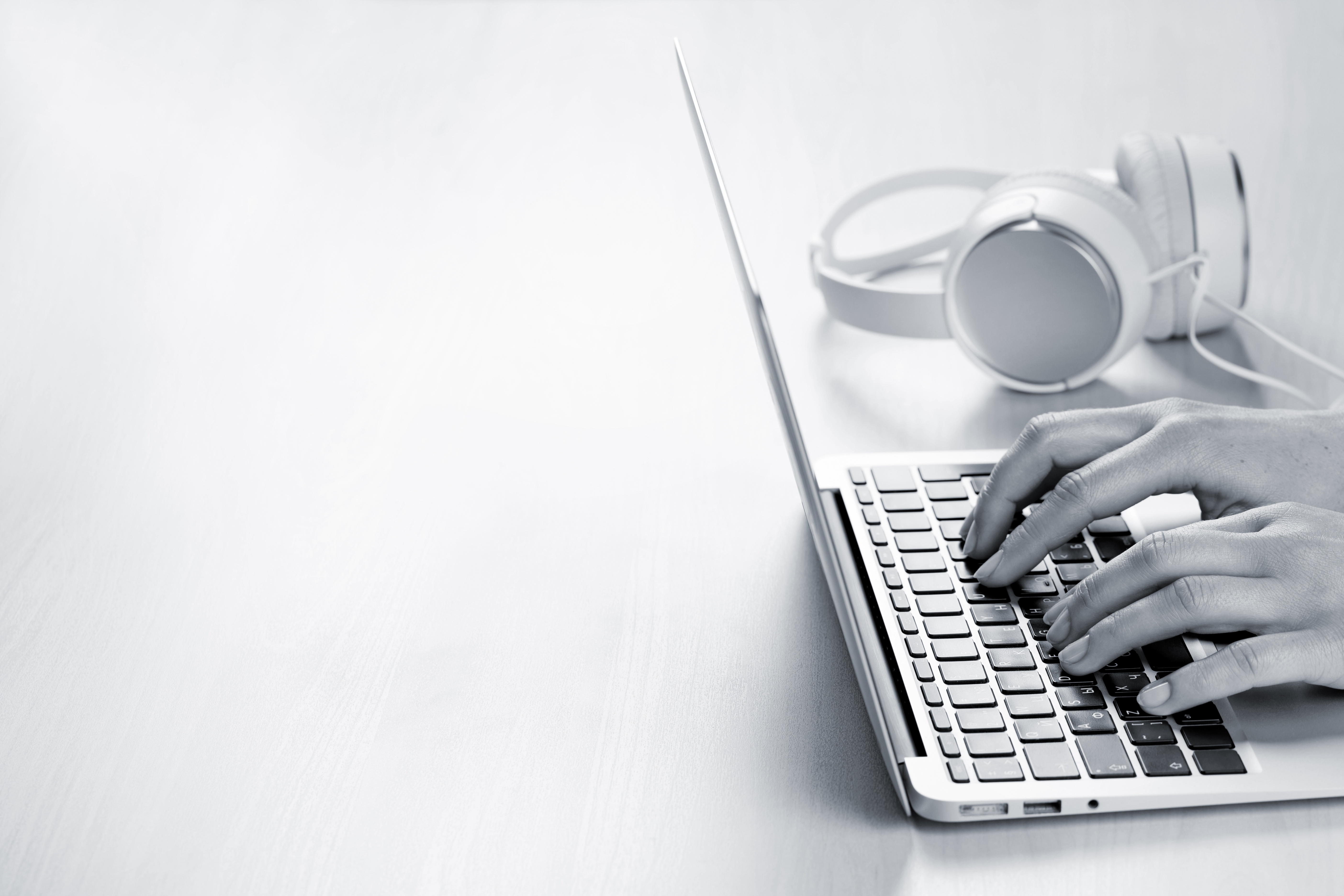 woman-working-on-laptop-hands-typing-on-keyboard-PMSXDSG